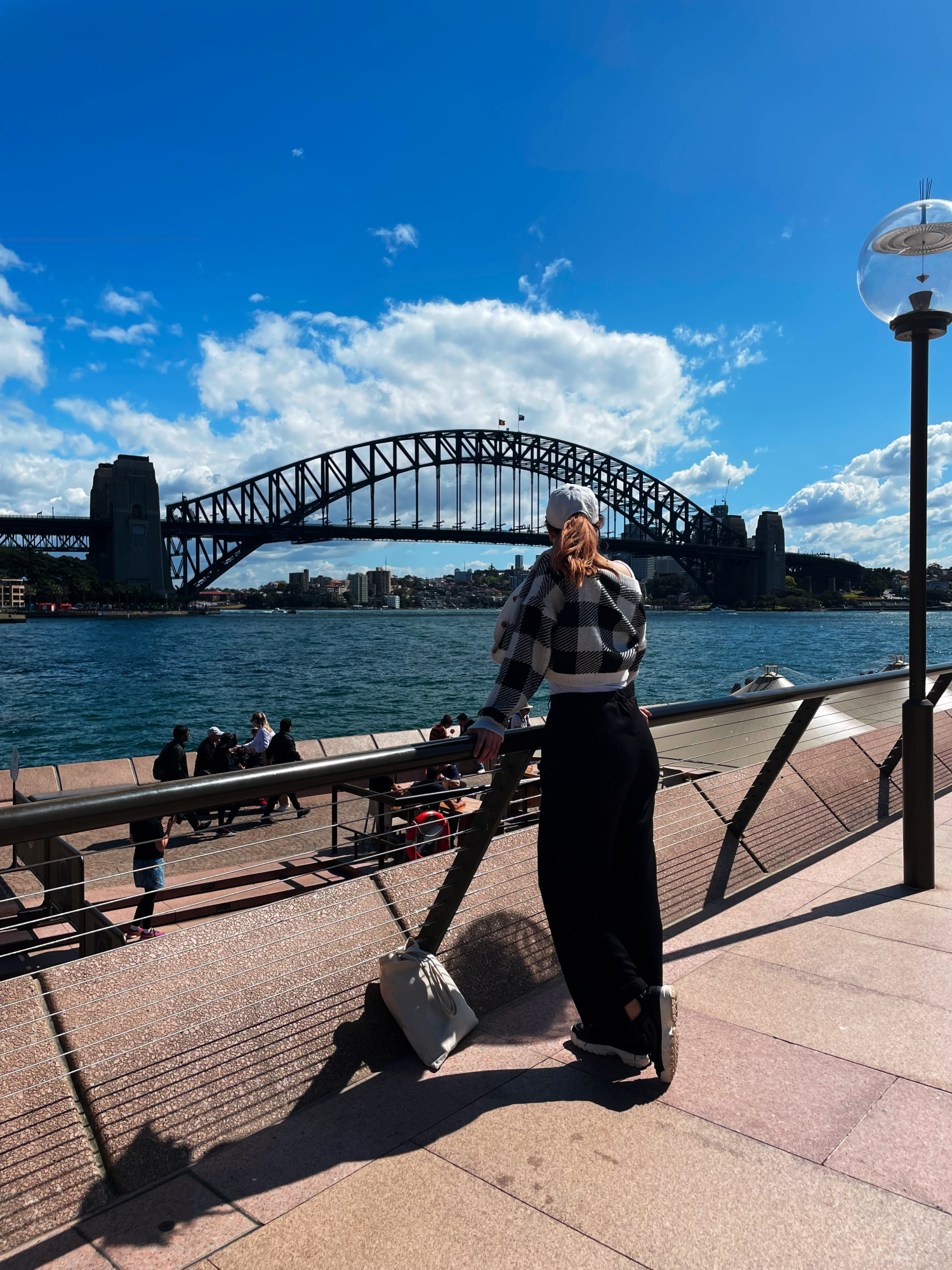 Girl in front of Sydney Harbor Bridge