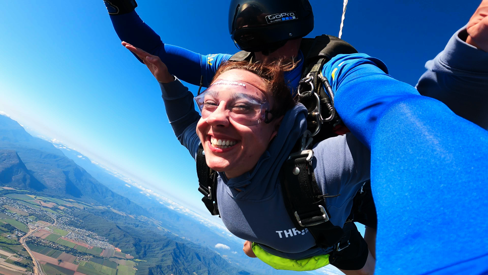 Girl during freefall while skydiving in cairns.