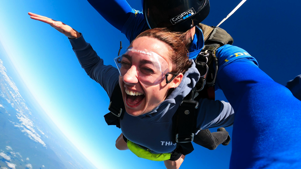 Girl screaming during freefall while skydiving in cairns.