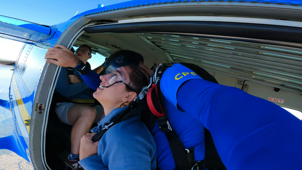 girl jumping out of a plane in cairns